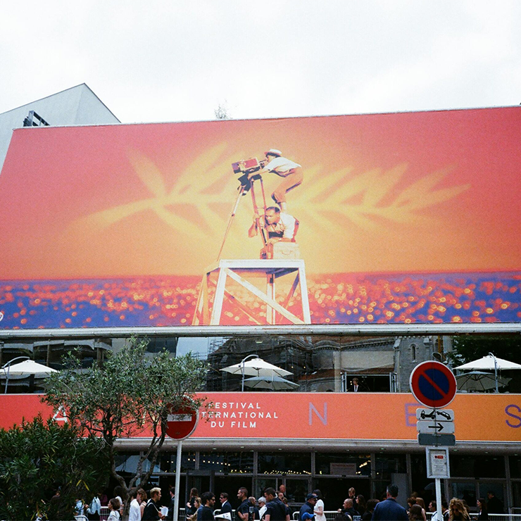 a large billboard with a picture of a man on a stand